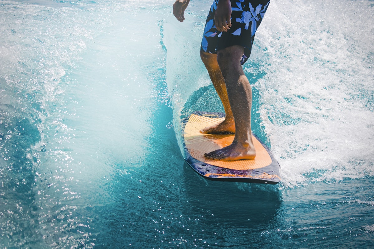 Surfer riding a wave at a tropical beach