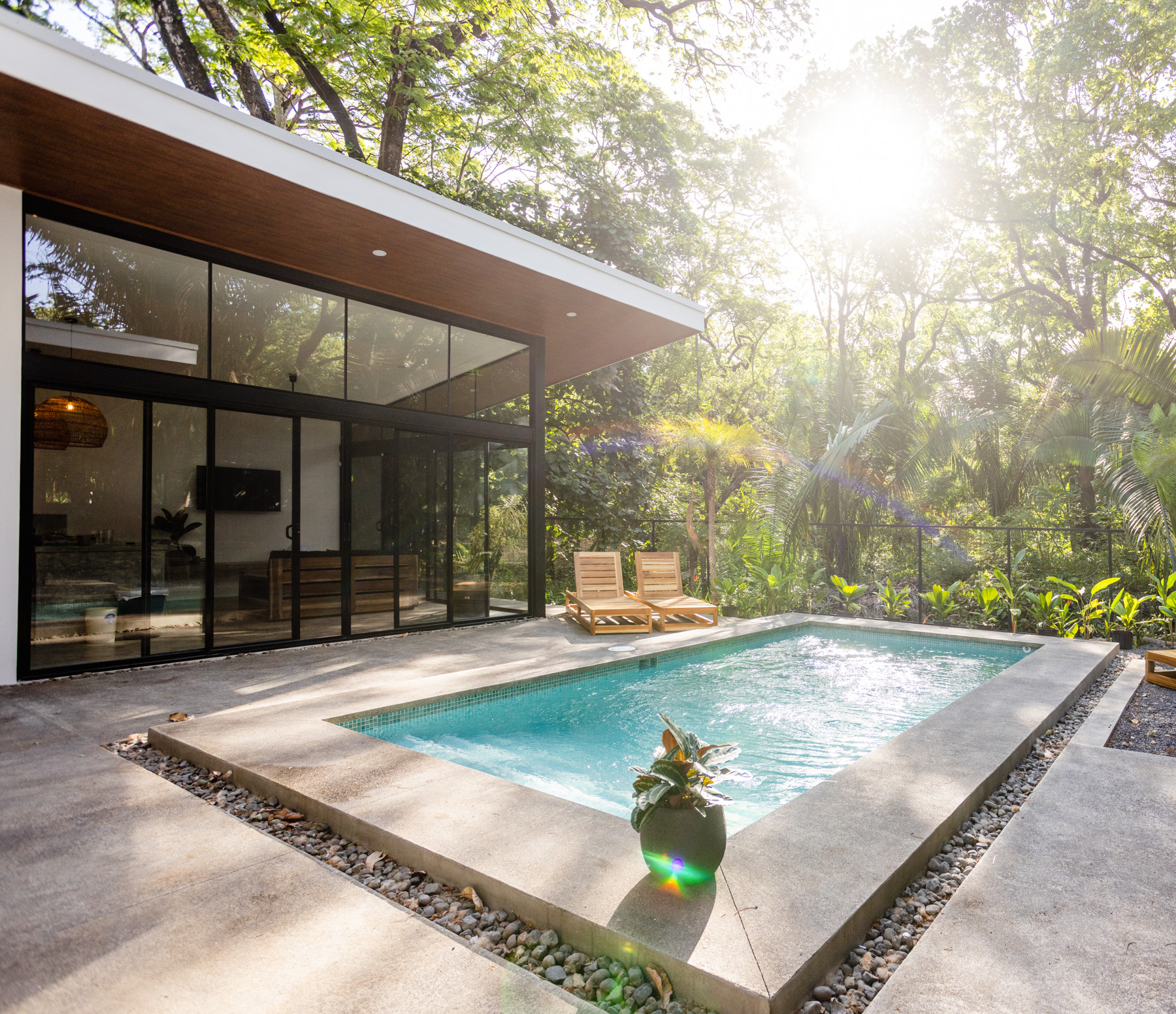 Kembar Nosara pool surrounded by tropical jungle at golden hour